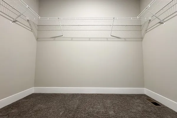a view of a room with racks on the wall