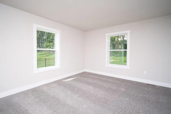 an empty room with windows