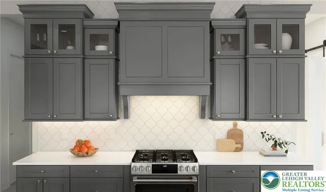 a kitchen with granite countertop cabinets and stove top oven