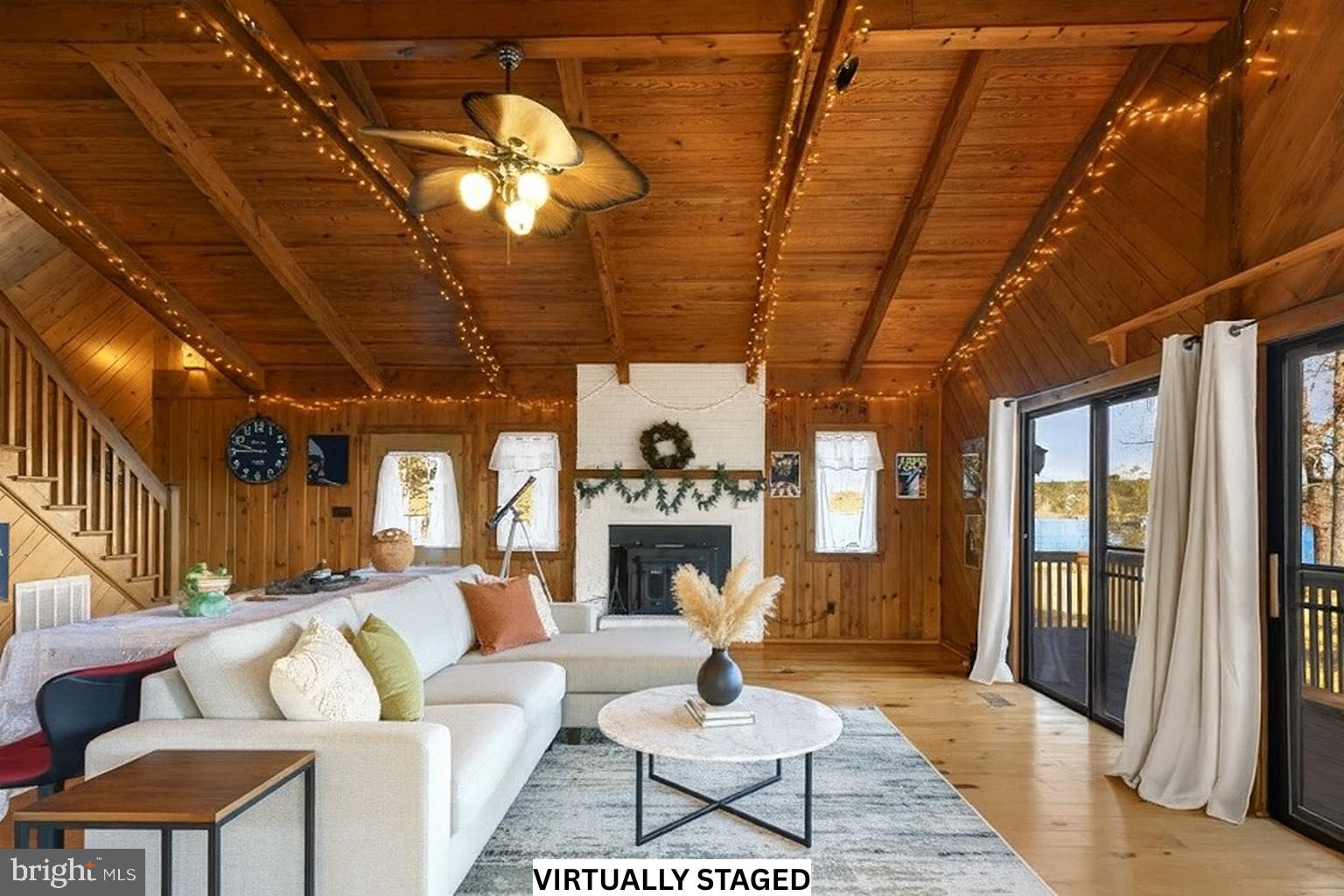 310 Brush Neck Road Susan, VA 23163 - Photo 13 of 70 a living room with furniture a fireplace and a chandelier