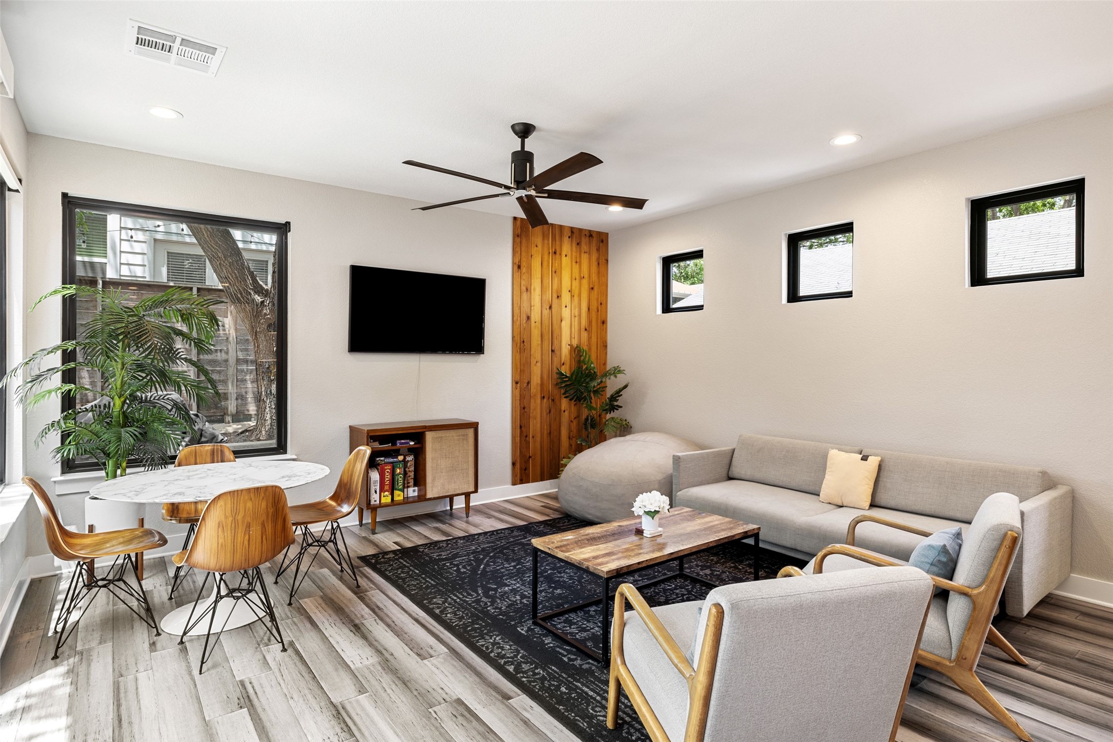 2202 Santa Rita Street Austin, TX 78702 - Photo 4 of 40 Living room downstairs with tons of natural light and large patio sliders out to backyard
