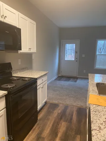 a kitchen with a stove and a sink