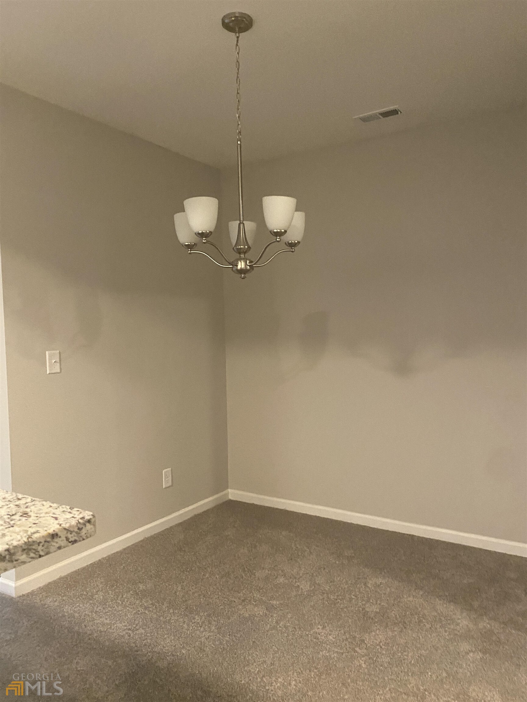 538 Maggie Lane Jonesboro, GA 30238 - Photo 3 of 8 a view of a room with a hanging light and kitchen