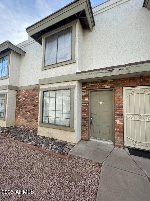 a front view of a house with a garage