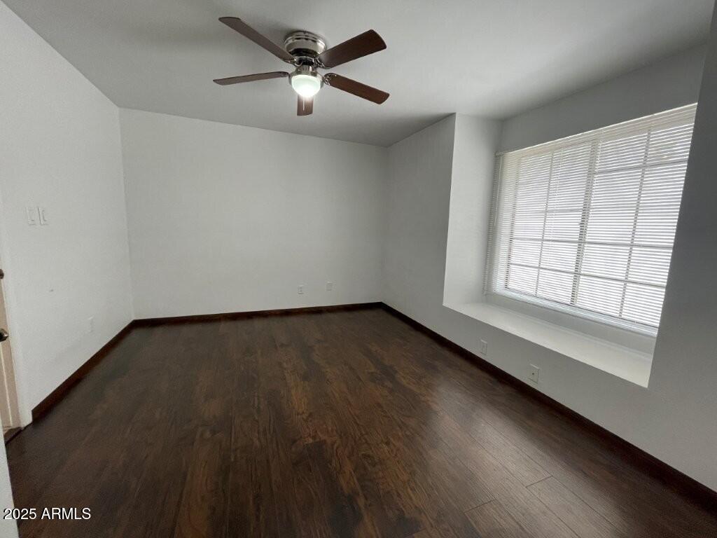 544 South Wilson Street, Unit 104 Tempe, AZ 85281 - Photo 8 of 15 wooden floor in an empty room with a window
