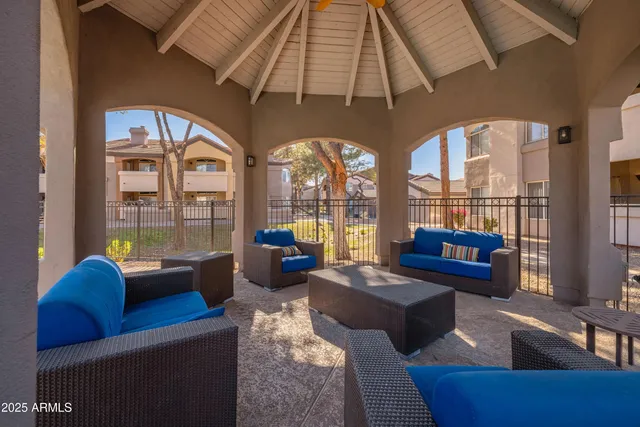 a view of swimming pool with an outdoor seating