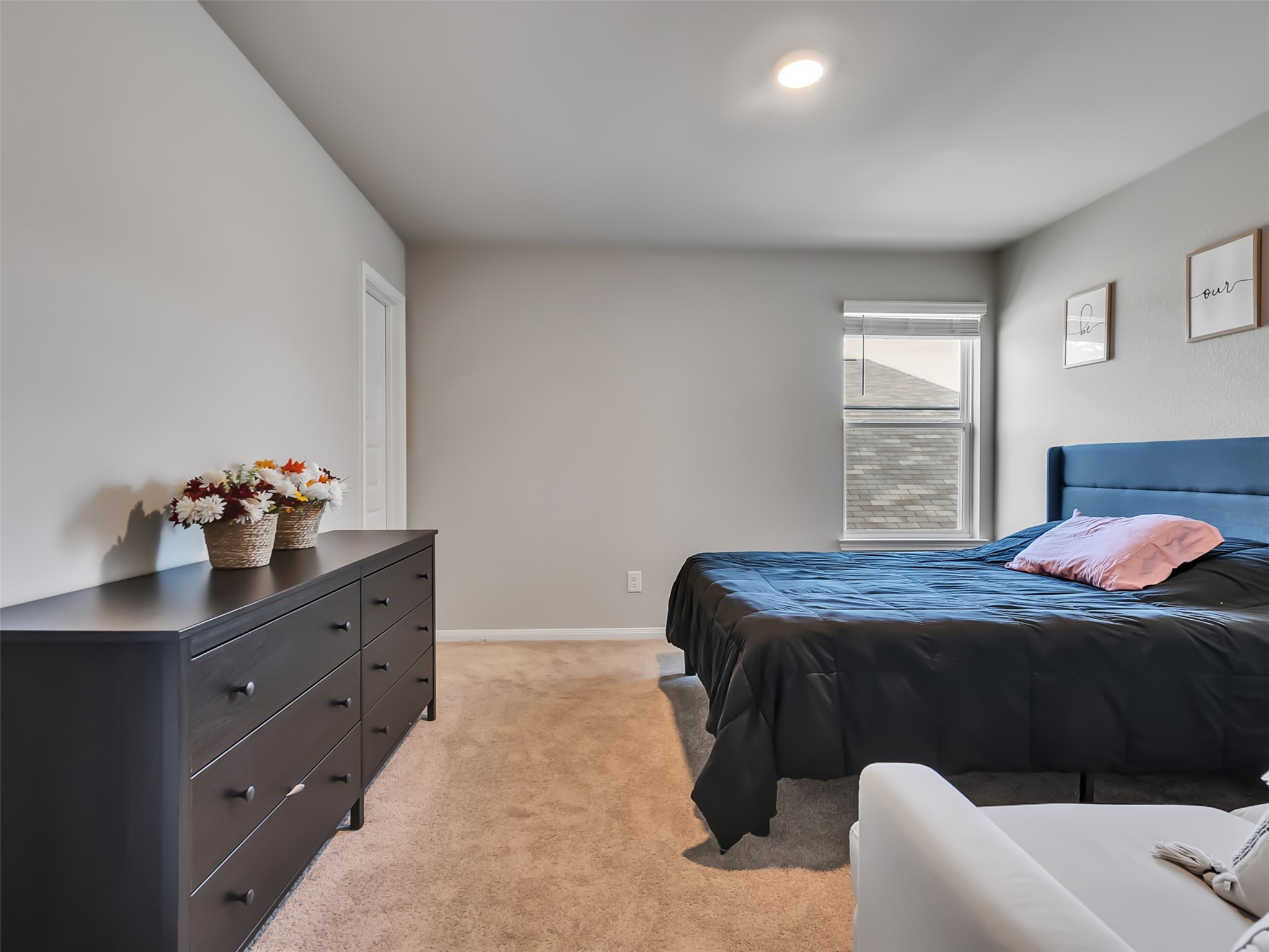 2416 Bluefish Court Conroe, TX 77384 - Photo 27 of 45 a bedroom with a bed and window