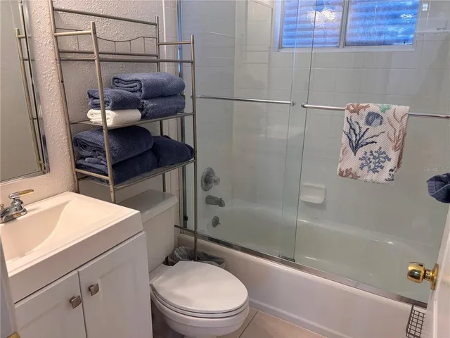 a bathroom with a toilet a sink and a bathtub
