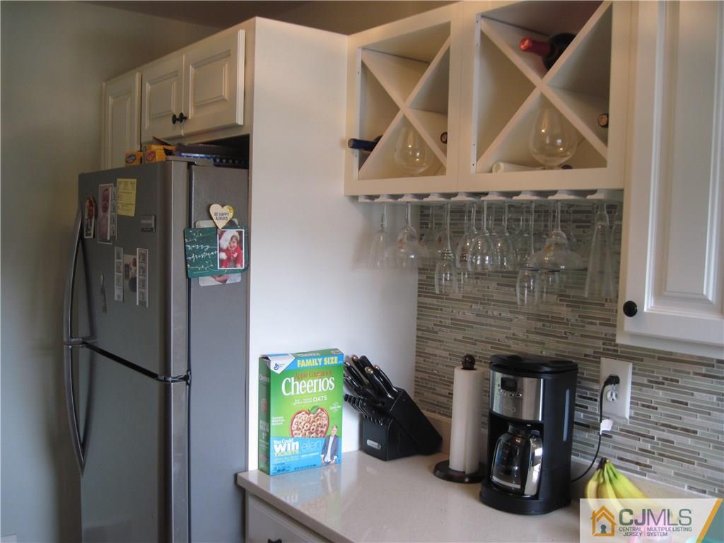 17 Georgetown Road Old Bridge, NJ 08859 - Photo 3 of 12 a kitchen with stainless steel appliances granite countertop a refrigerator and a stove