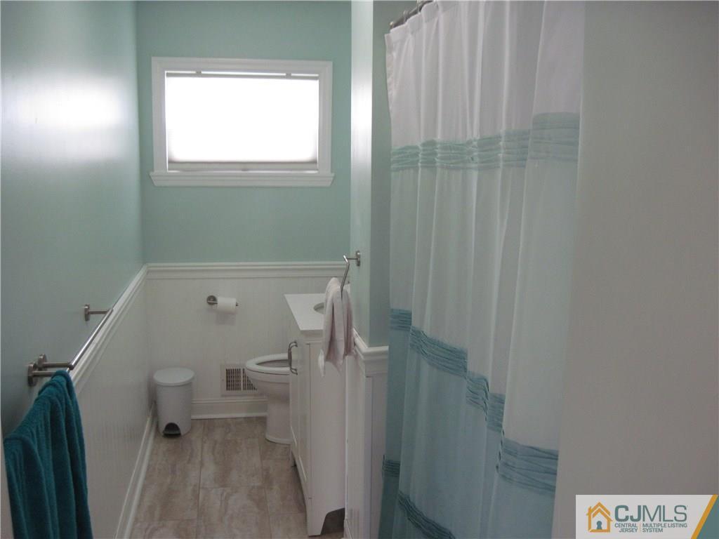 17 Georgetown Road Old Bridge, NJ 08859 - Photo 4 of 12 a bathroom with a toilet and a shower
