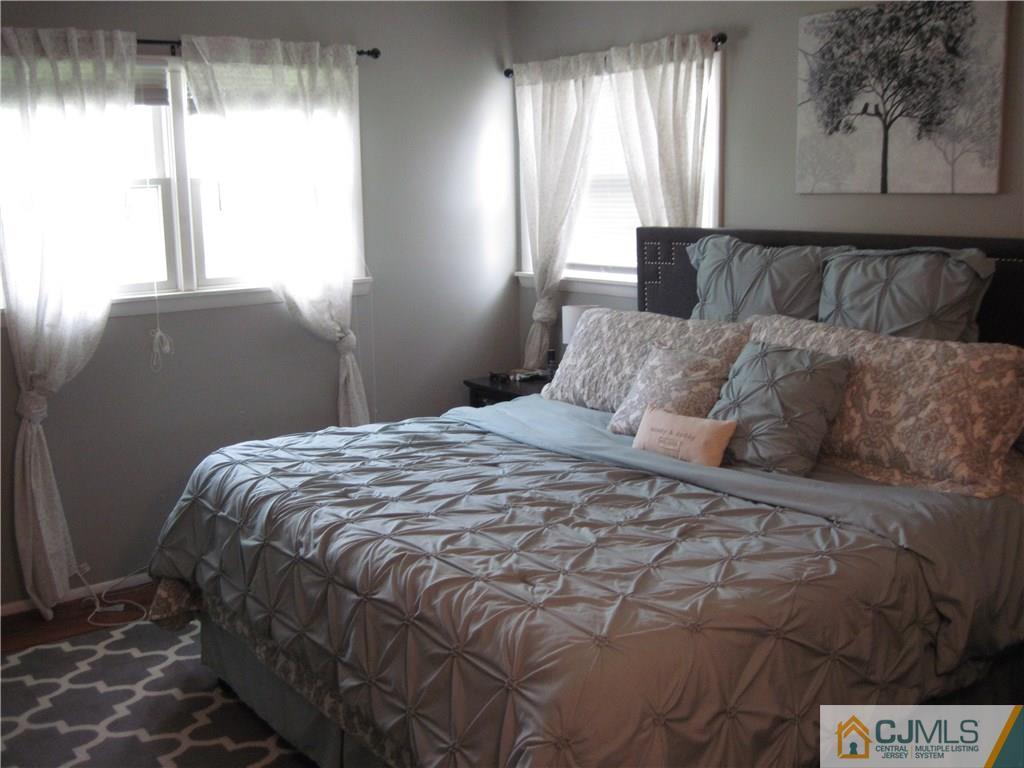 17 Georgetown Road Old Bridge, NJ 08859 - Photo 5 of 12 a bedroom with a bed and window