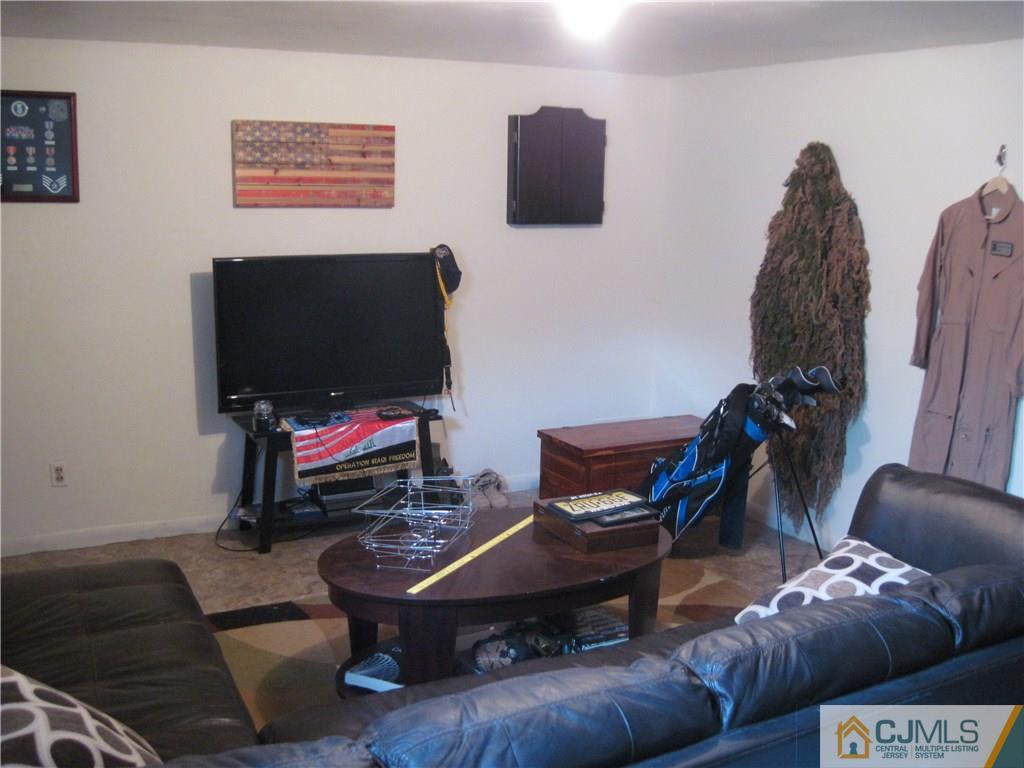 17 Georgetown Road Old Bridge, NJ 08859 - Photo 6 of 12 a living room with furniture and a flat screen tv