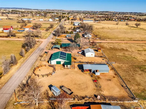 an aerial view of residential houses with outdoor space