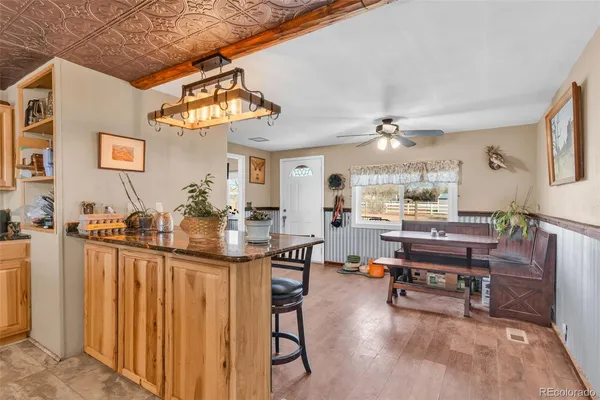 a living room with lots of furniture and a chandelier