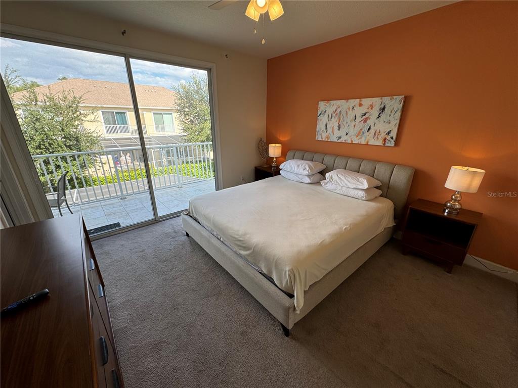 1641 Retreat Circle Clermont, FL 34714 - Photo 9 of 16 a bed sitting in a bedroom next to a window