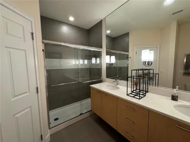 a bathroom with a sink and mirror
