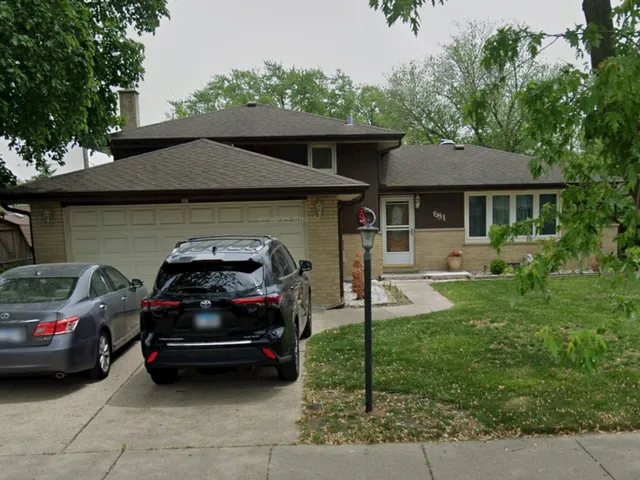 a car parked in front of a house