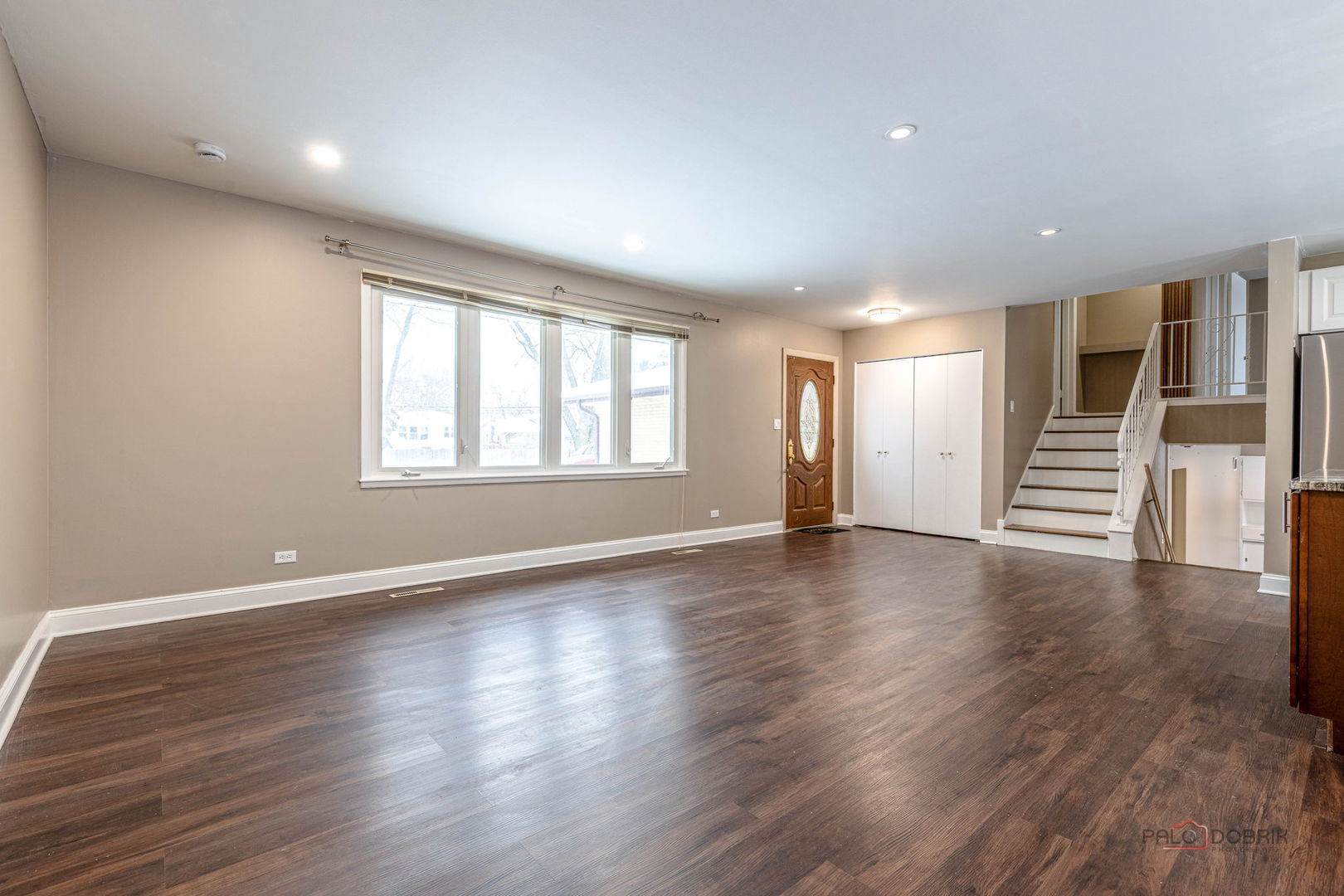 681 South Mt Prospect Road Des Plaines, IL 60016 - Photo 4 of 20 a view of an empty room with wooden floor and windows
