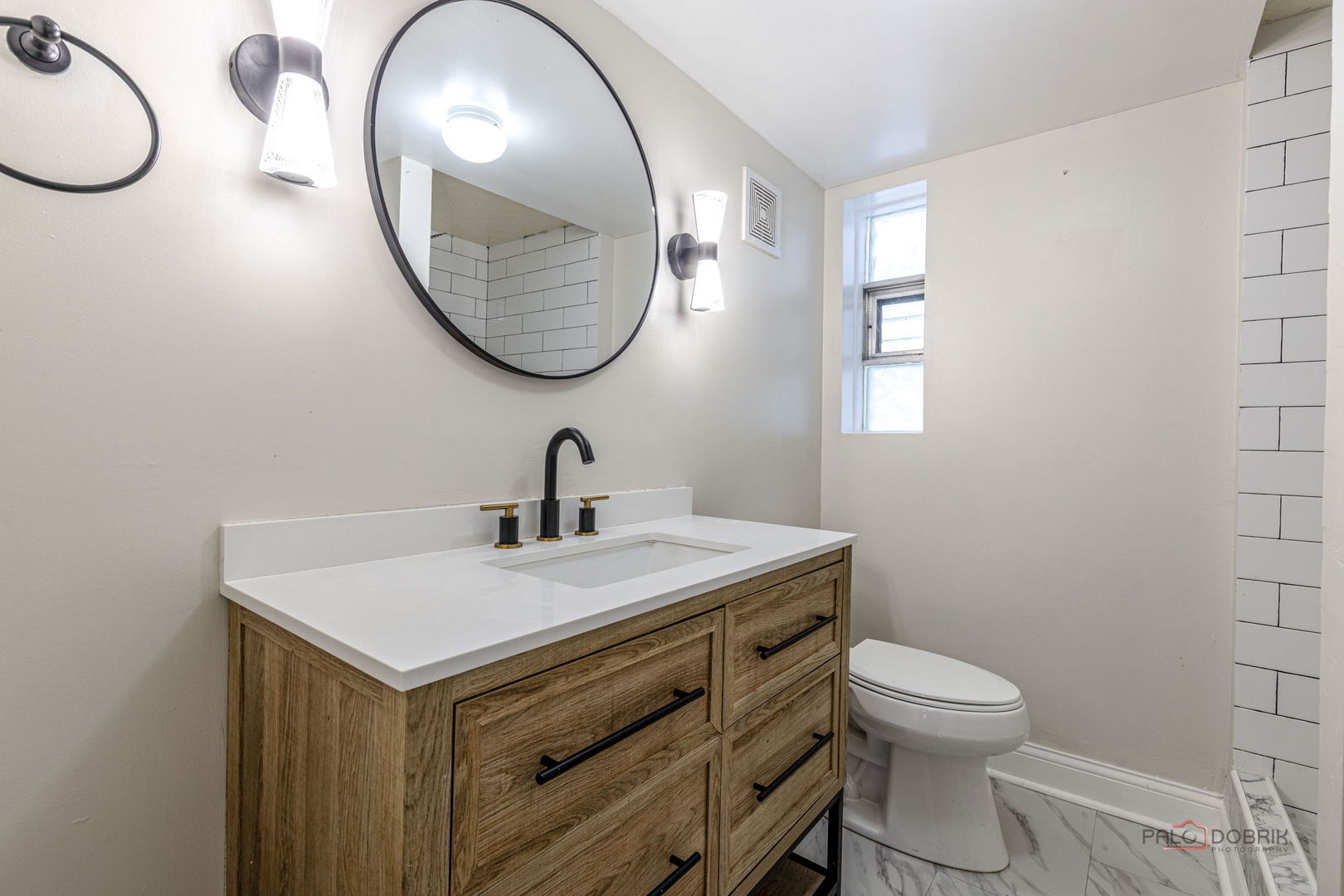 681 South Mt Prospect Road Des Plaines, IL 60016 - Photo 8 of 20 a bathroom with a toilet a sink and mirror