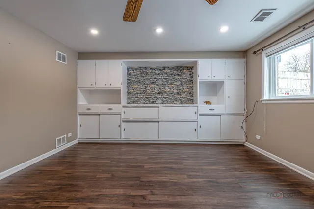 a view of a kitchen with wooden floor