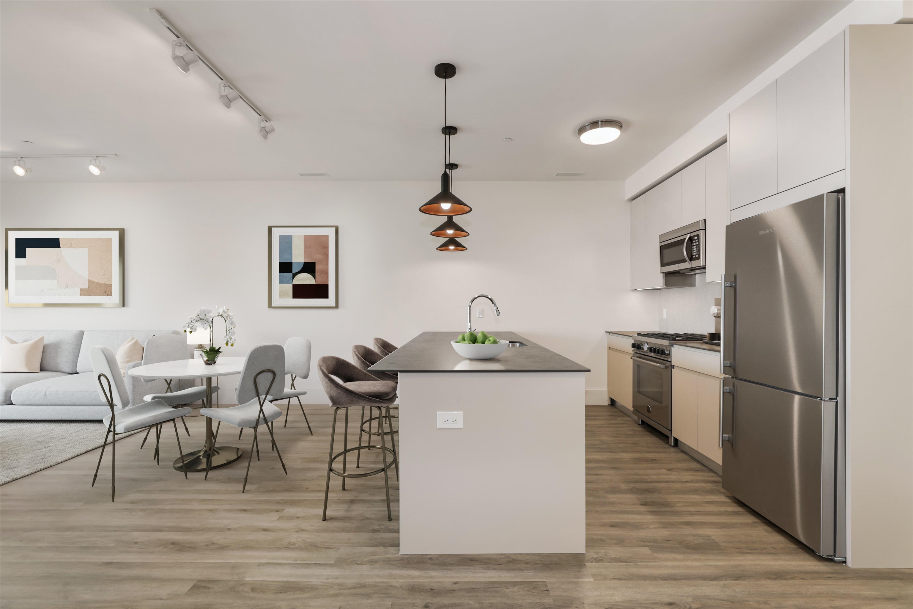 a kitchen with granite countertop a sink appliances and cabinets