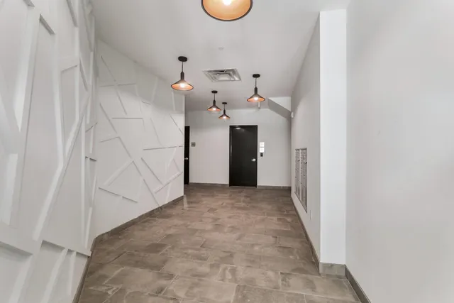 a view of a hallway with entryway