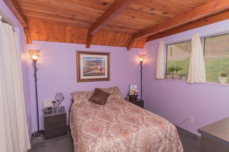 45852 Mineral King Road Three Rivers, CA 93271 - Photo 12 of 36 a bedroom with a bed and a window