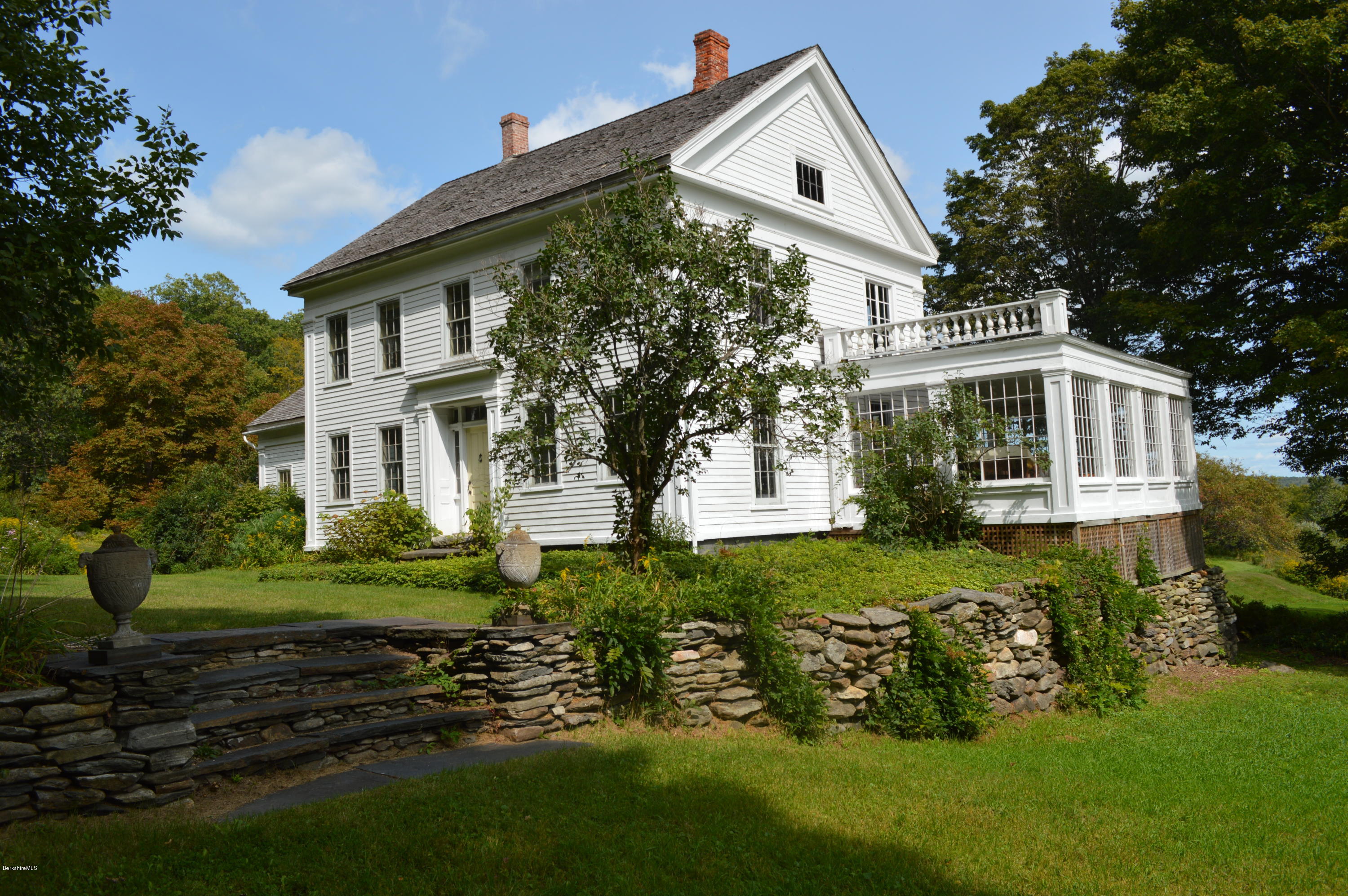 128 Chipman Road Middlefield, MA 01011 - Photo 1 of 61 a front view of a house with a yard