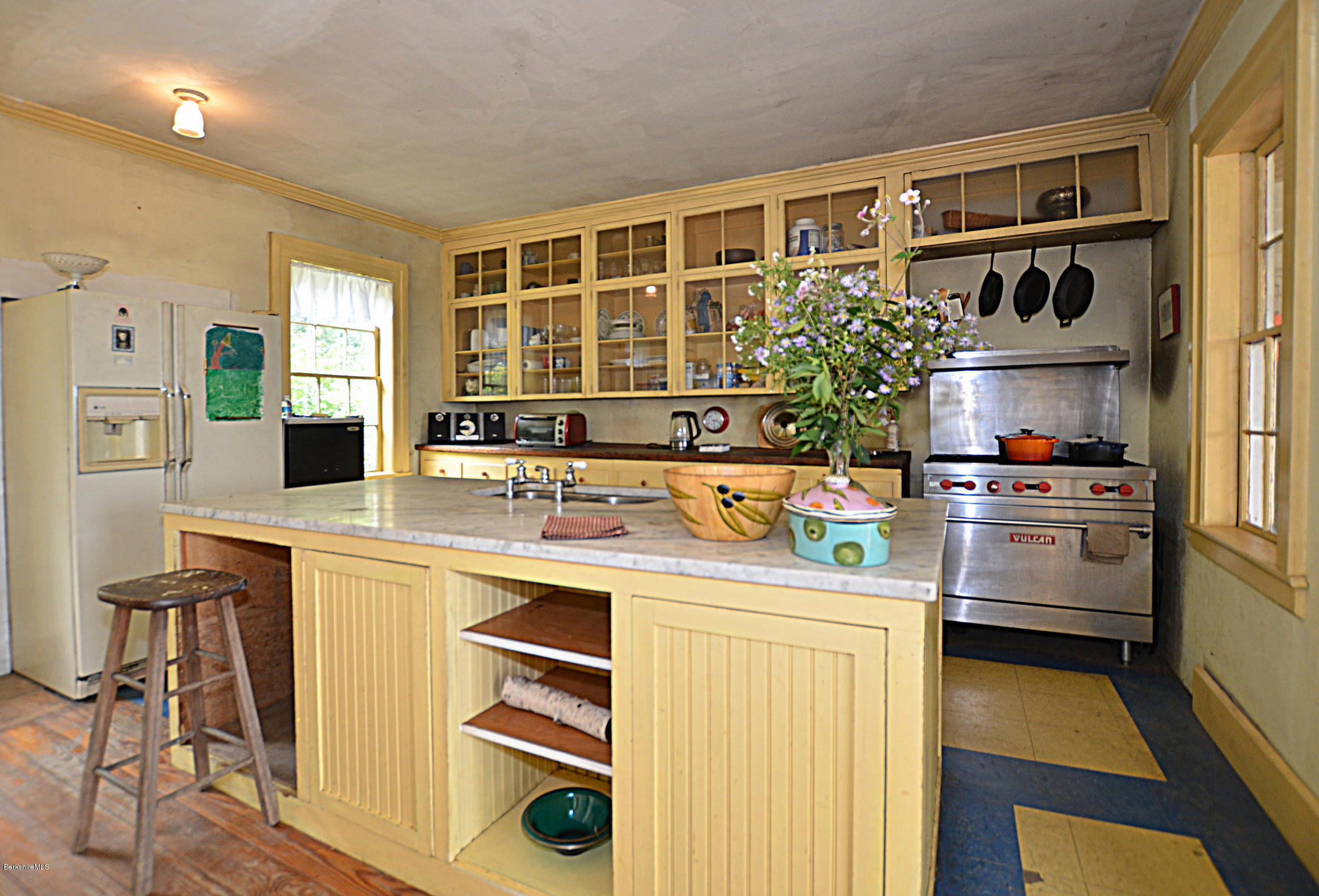 128 Chipman Road Middlefield, MA 01011 - Photo 18 of 61 a kitchen with stainless steel appliances kitchen island granite countertop a stove and a refrigerator