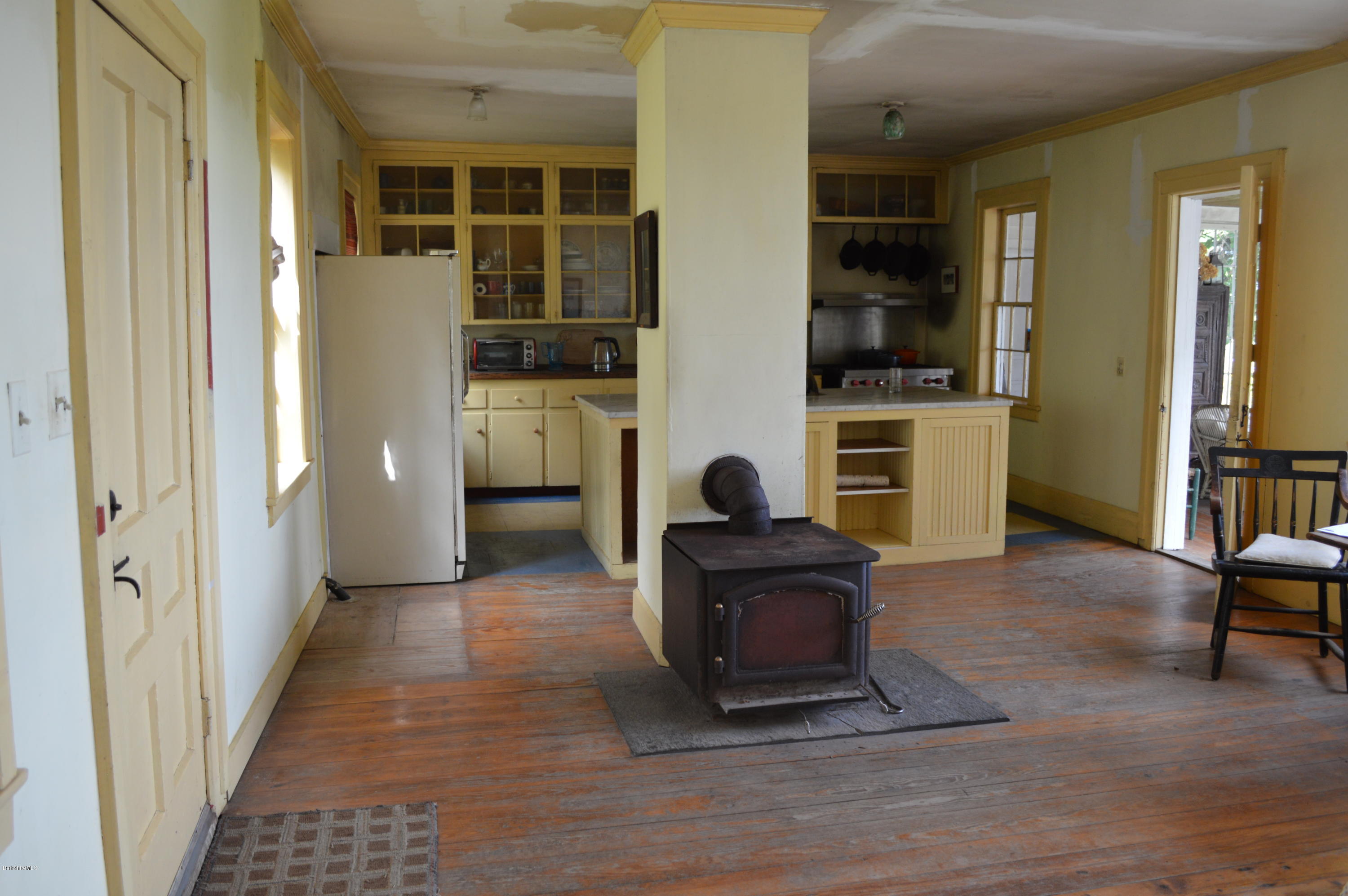 128 Chipman Road Middlefield, MA 01011 - Photo 19 of 61 a living room with furniture and a fireplace