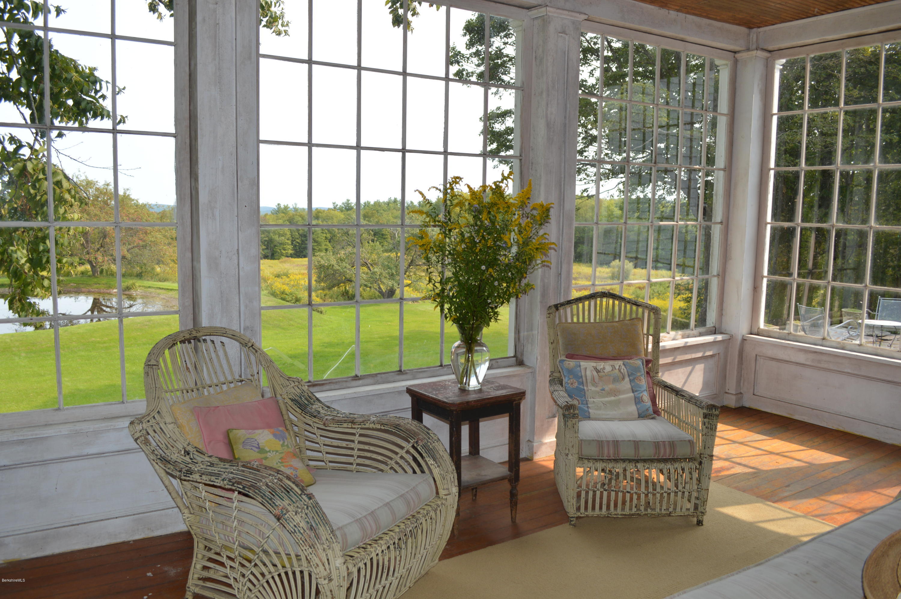 128 Chipman Road Middlefield, MA 01011 - Photo 22 of 61 a view of a patio with a table chairs and a backyard