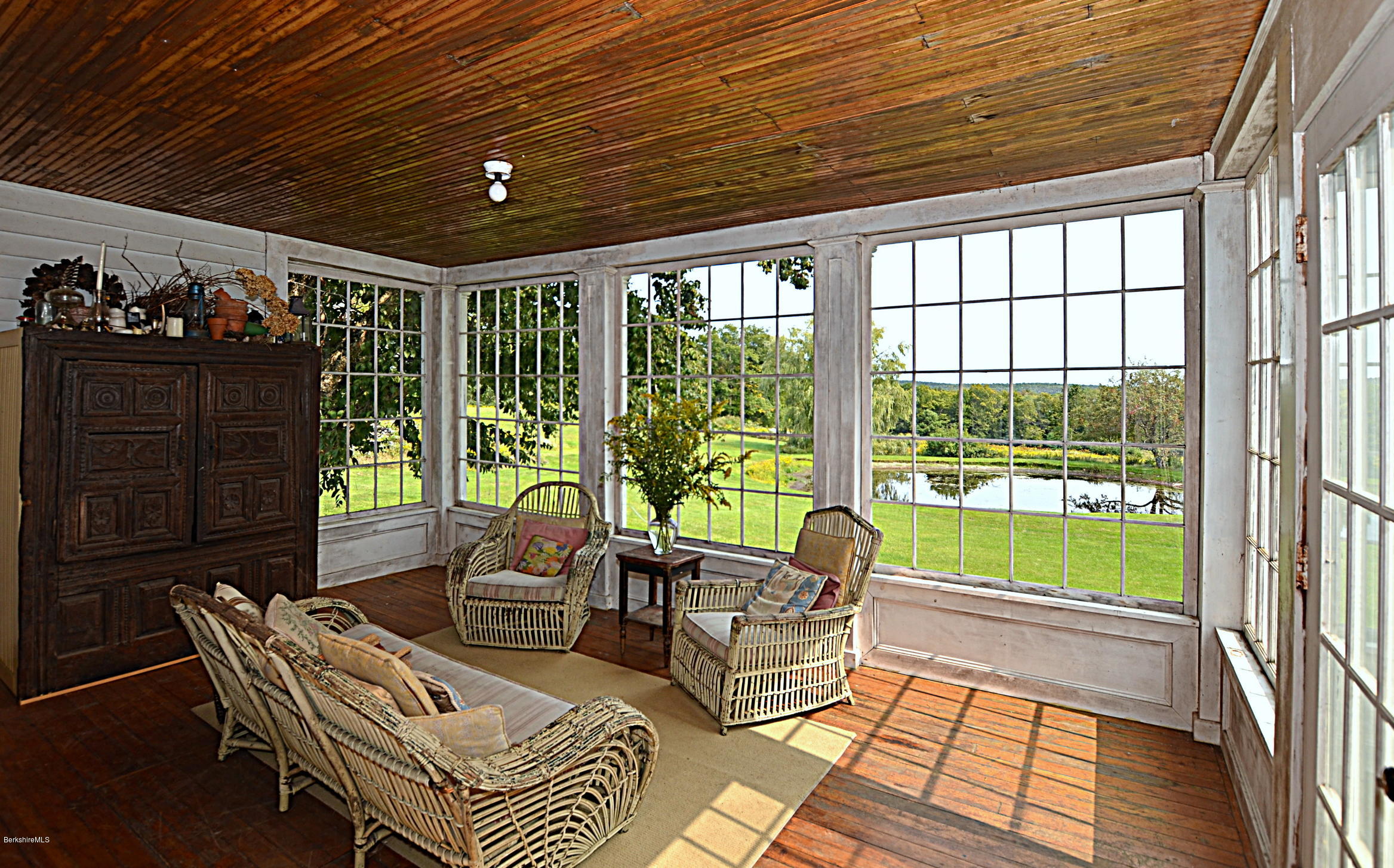 128 Chipman Road Middlefield, MA 01011 - Photo 23 of 61 a living room with furniture and a floor to ceiling window