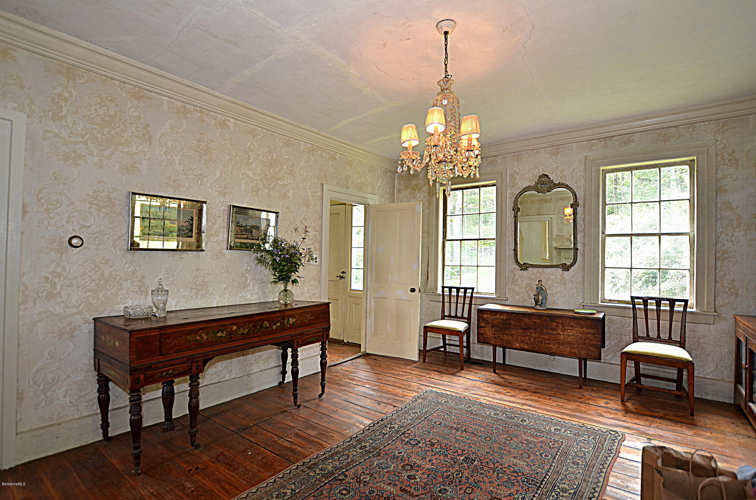 128 Chipman Road Middlefield, MA 01011 - Photo 25 of 61 a living room with furniture and a chandelier