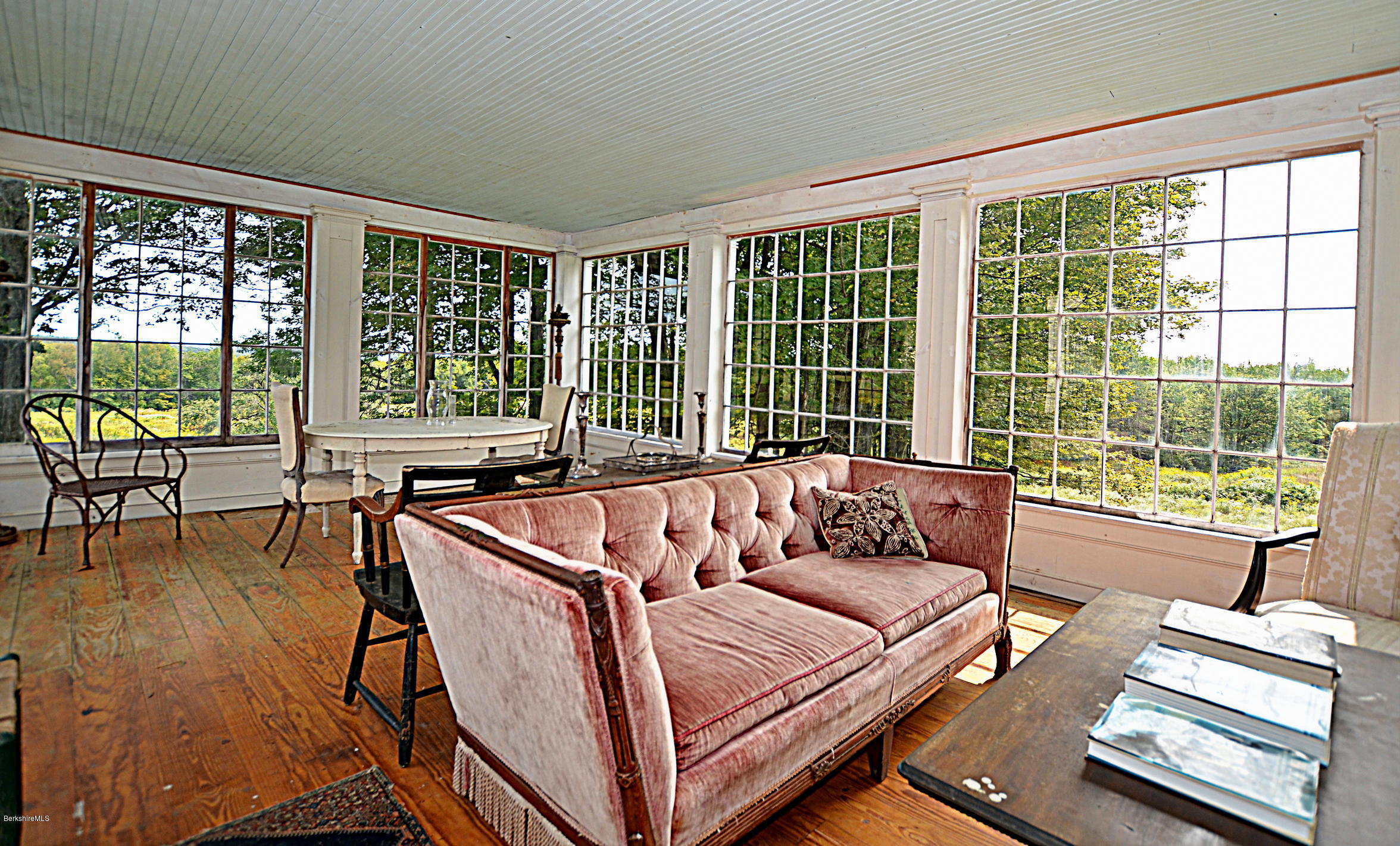 128 Chipman Road Middlefield, MA 01011 - Photo 27 of 61 a living room with furniture and floor to ceiling windows