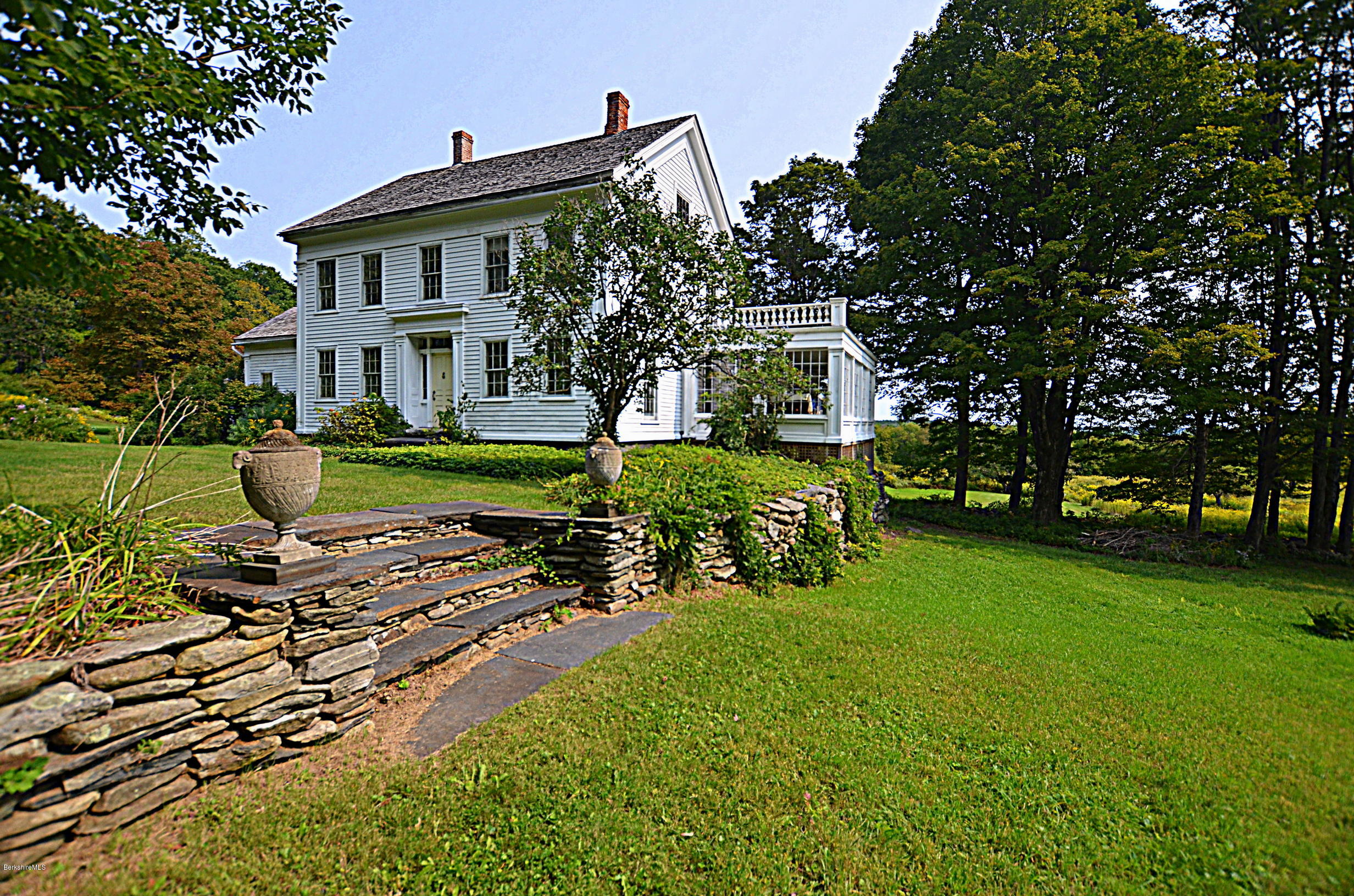 128 Chipman Road Middlefield, MA 01011 - Photo 4 of 61 a front view of a house with a yard