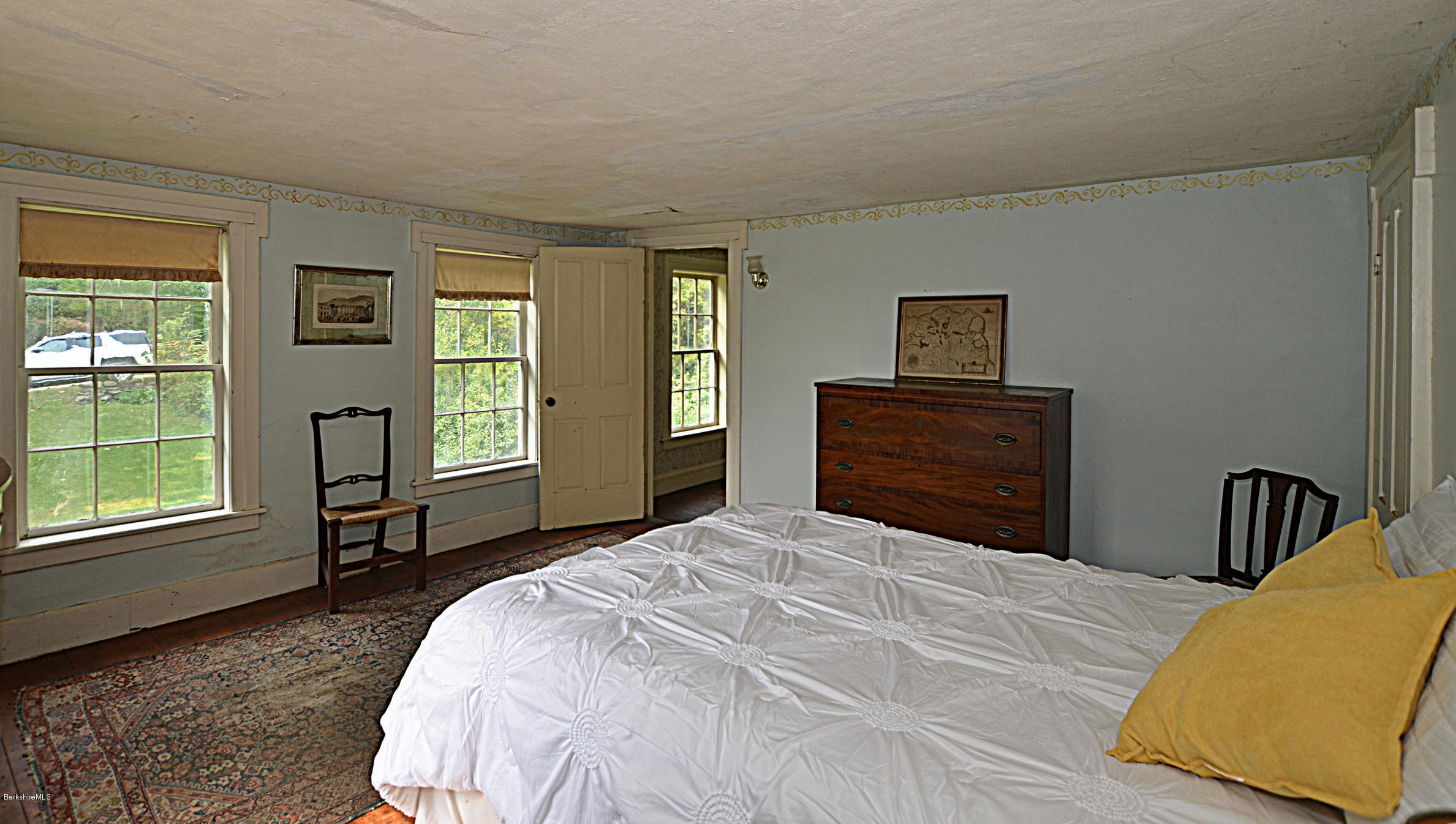 128 Chipman Road Middlefield, MA 01011 - Photo 38 of 61 a bedroom with a bed and a dresser next to a window