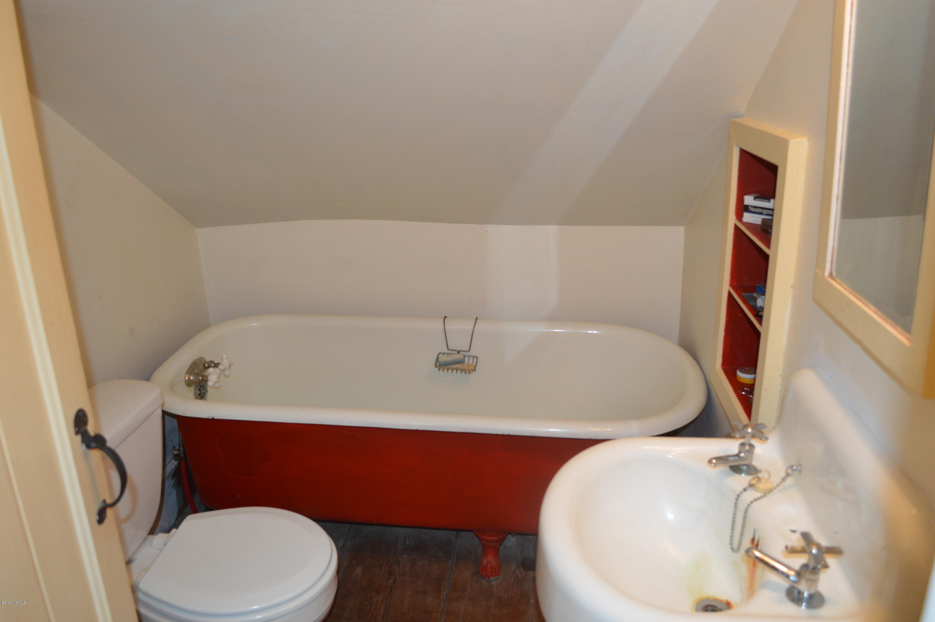 128 Chipman Road Middlefield, MA 01011 - Photo 40 of 61 a bathroom with a sink a toilet and mirror