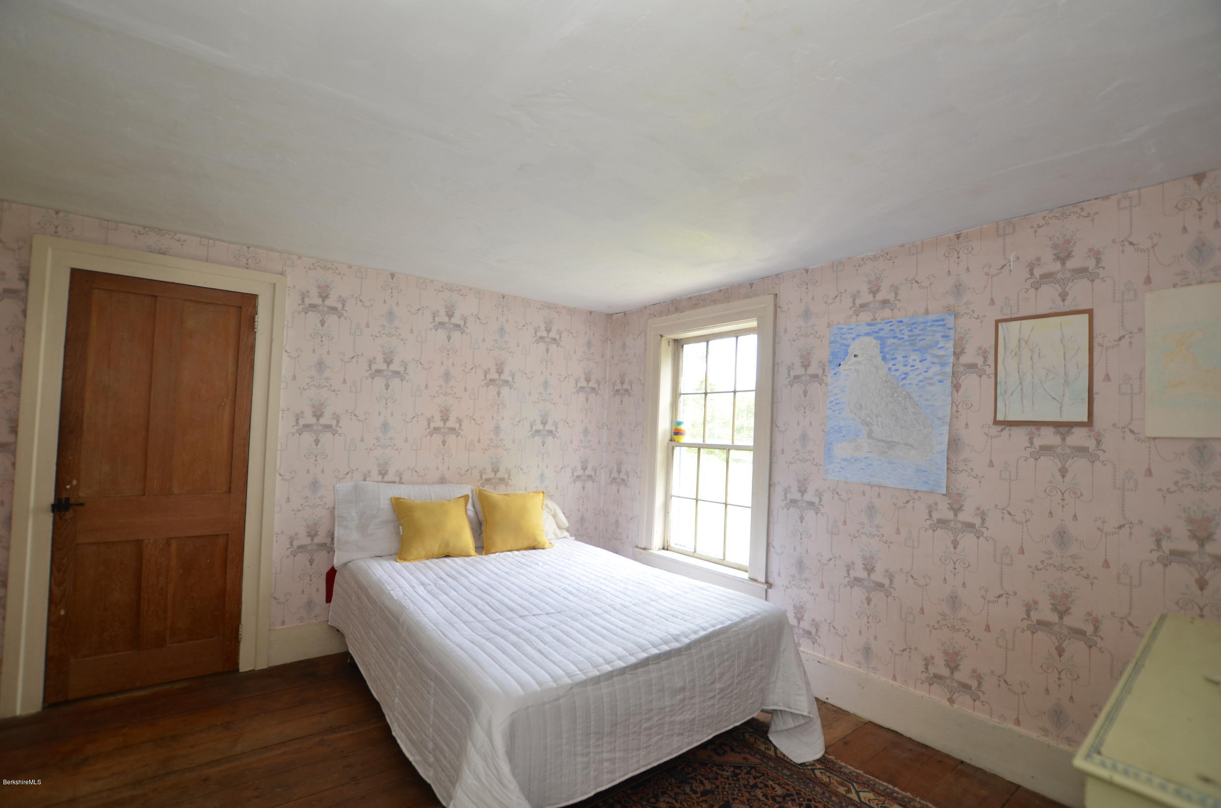 128 Chipman Road Middlefield, MA 01011 - Photo 42 of 61 a bedroom with a bed and wooden floor