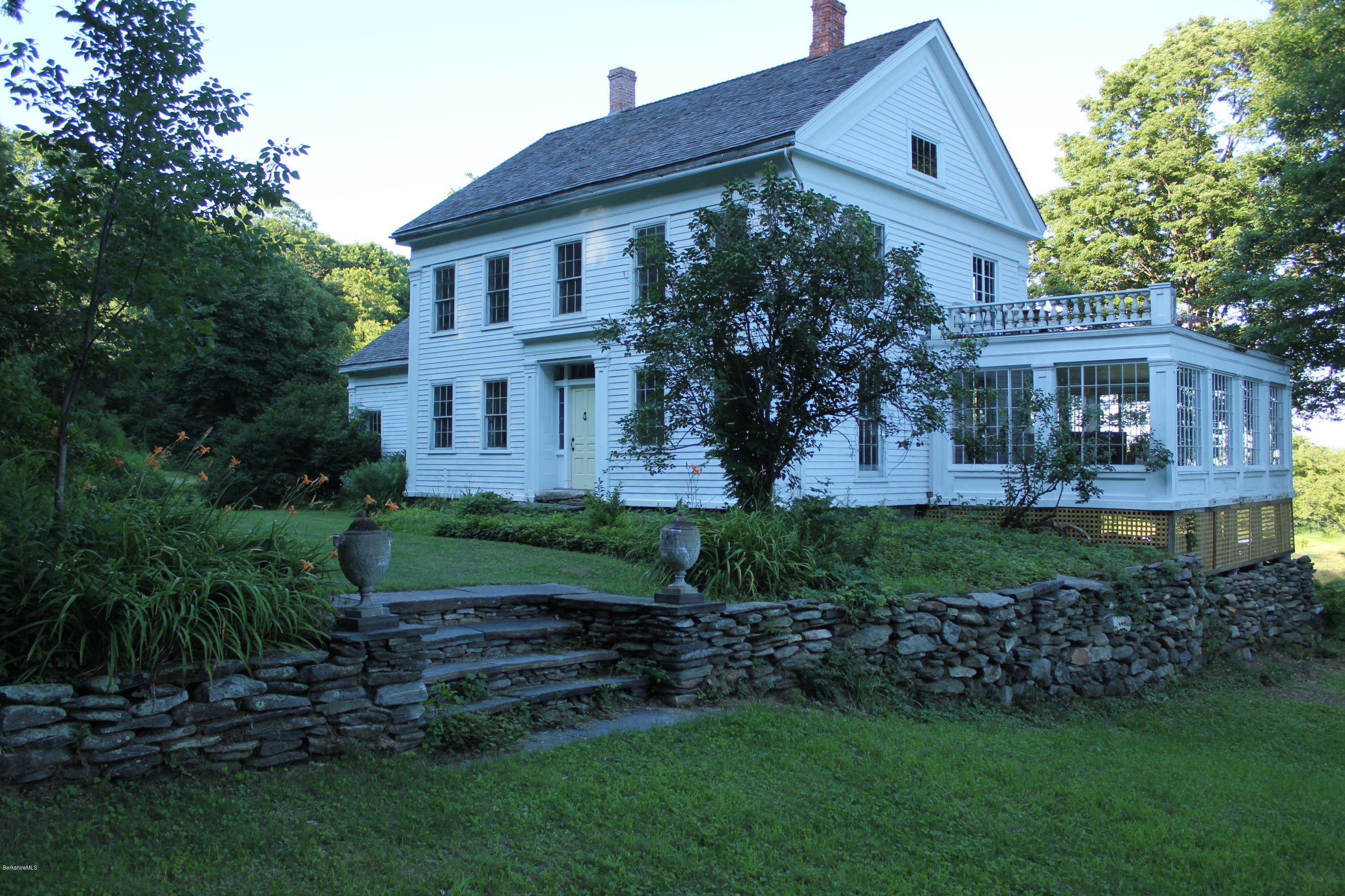 128 Chipman Road Middlefield, MA 01011 - Photo 46 of 61 a front view of a house with a garden