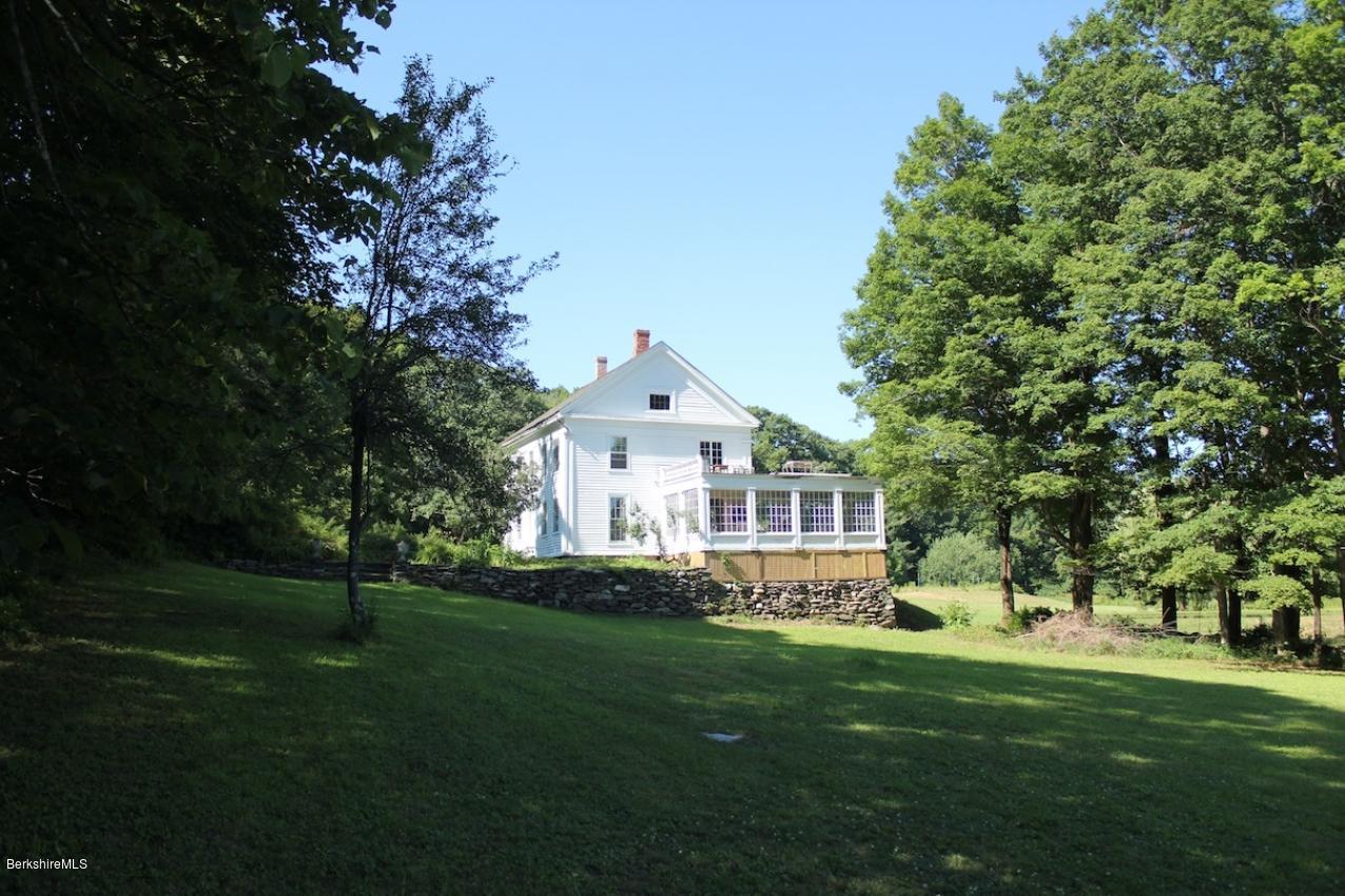 128 Chipman Road Middlefield, MA 01011 - Photo 49 of 61 a front view of a house with a yard