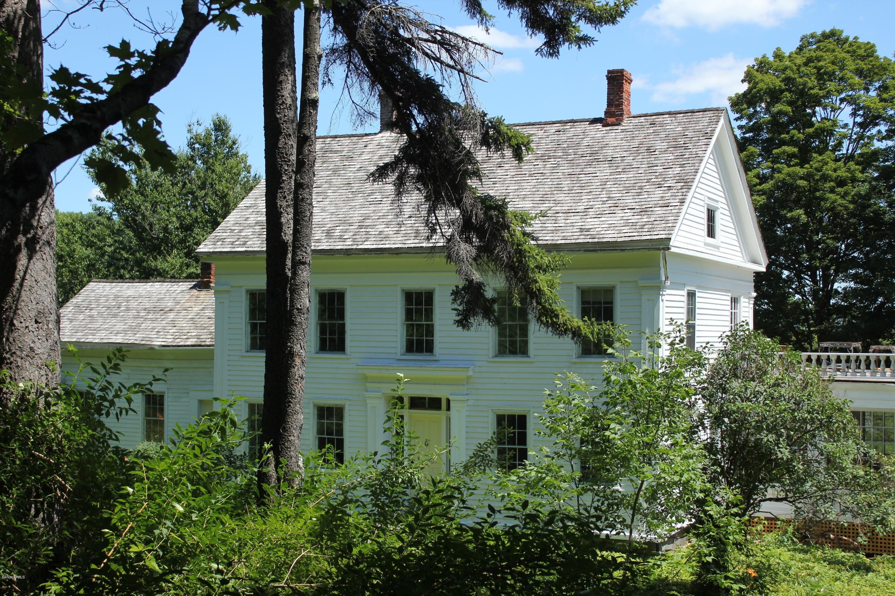 128 Chipman Road Middlefield, MA 01011 - Photo 57 of 61 a view of a house with a yard and plants