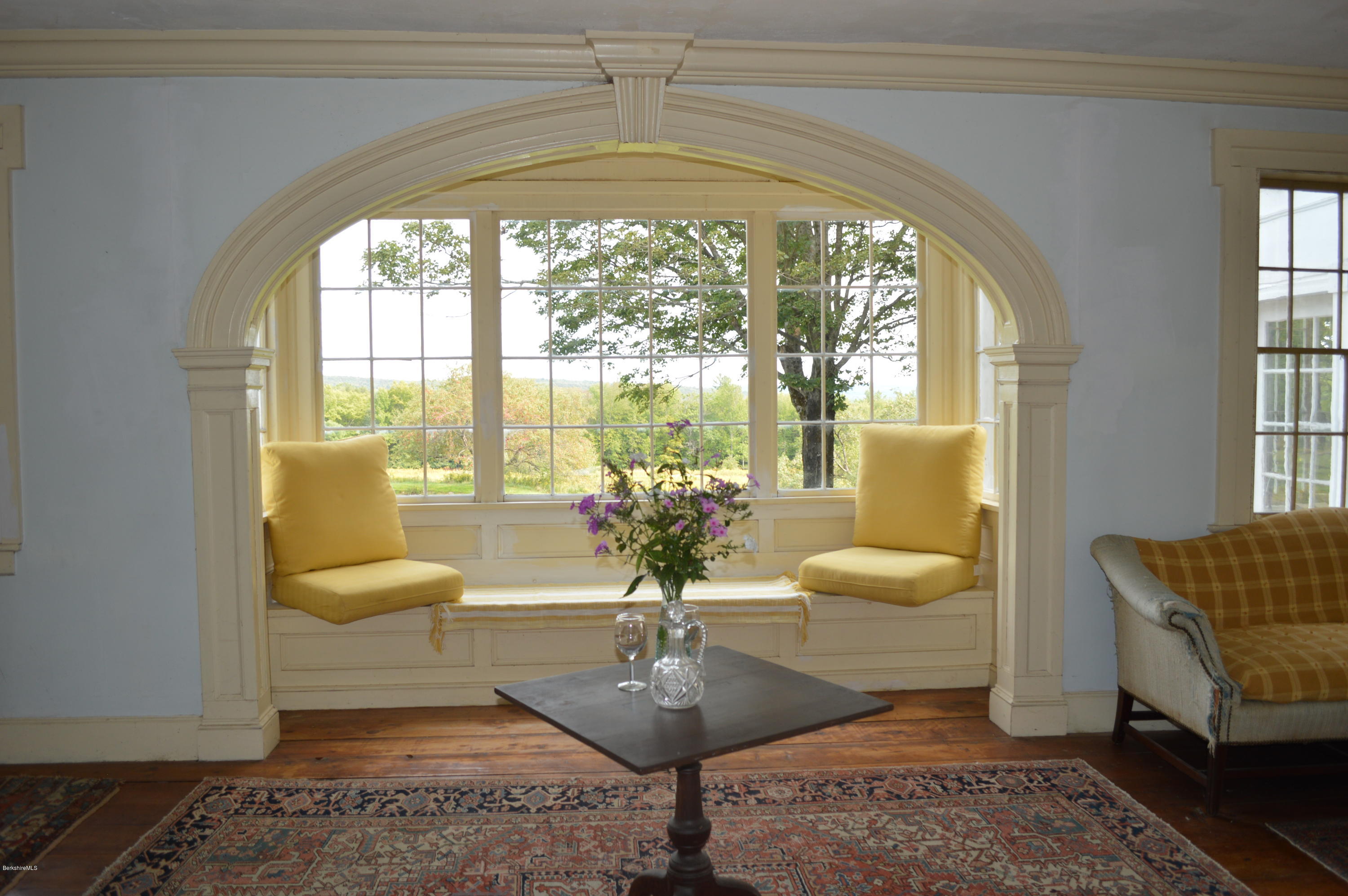 128 Chipman Road Middlefield, MA 01011 - Photo 7 of 61 a living room with patio furniture and a large window