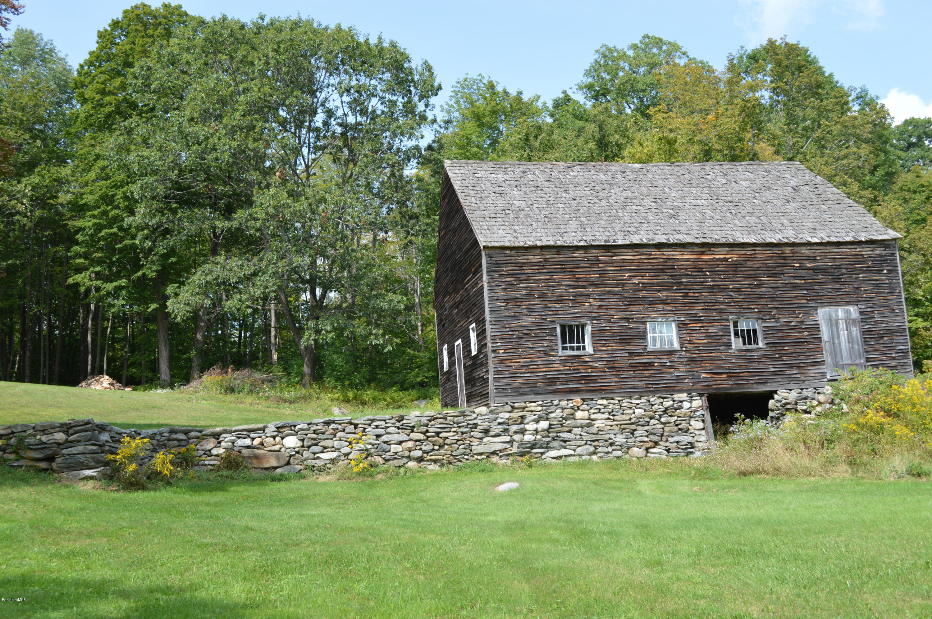 128 Chipman Road Middlefield, MA 01011 - Photo 61 of 61 a view of house with a yard