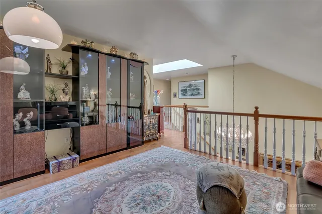 a view of a livingroom with furniture and staircase