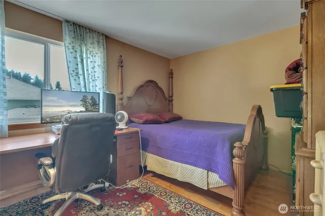 a bedroom with furniture and a window