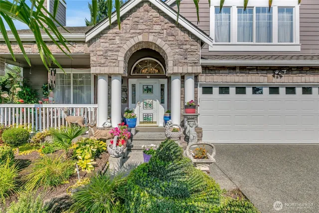 a front view of a house with garden