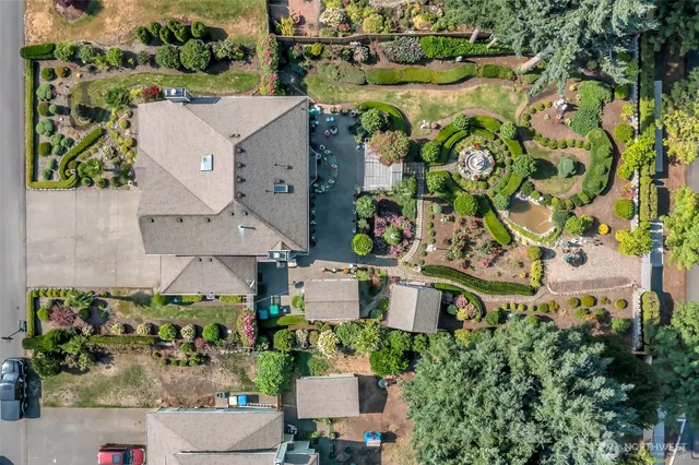 an aerial view of a house with a garden and plants
