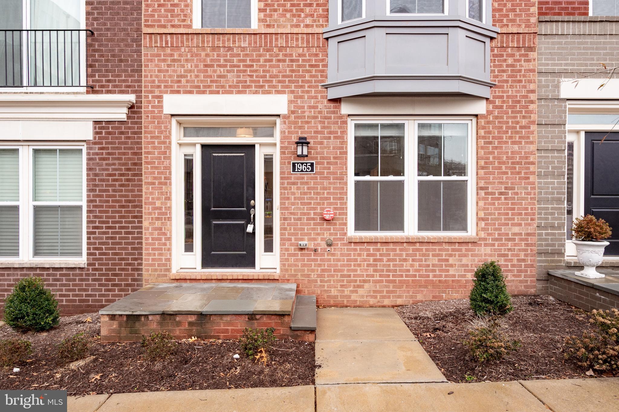 1965 Roland Clarke Place Reston, VA 20191 - Photo 5 of 70 Brick Exterior with Bump Out Bay Windows