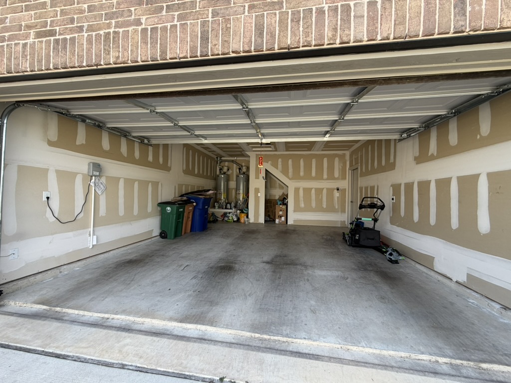 10708 Gonzales Ranger Pass Austin, TX 78754 - Photo 35 of 40 A spacious garage, ready for completion with ample storage potential, awaits customization.
