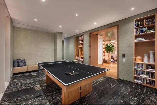 a room with lots of furniture and wooden floor